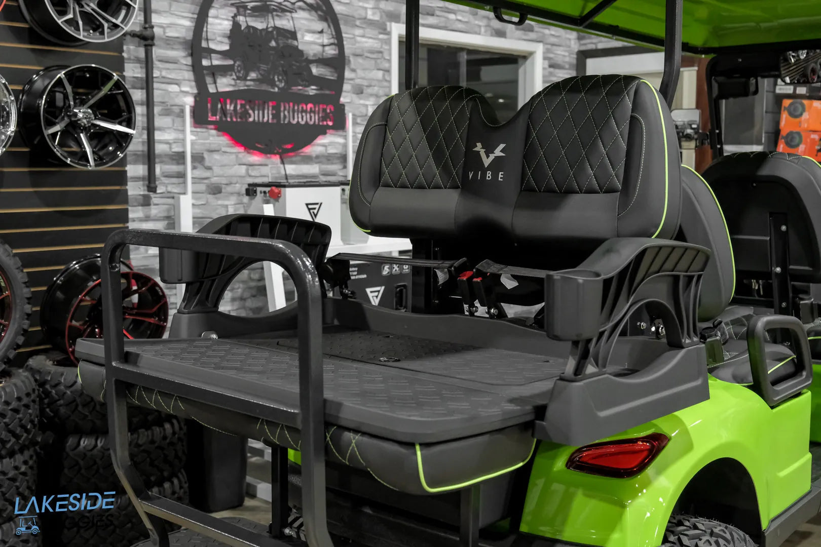 Lime green golf cart with black seats.