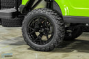 Black off-road tire and rim.