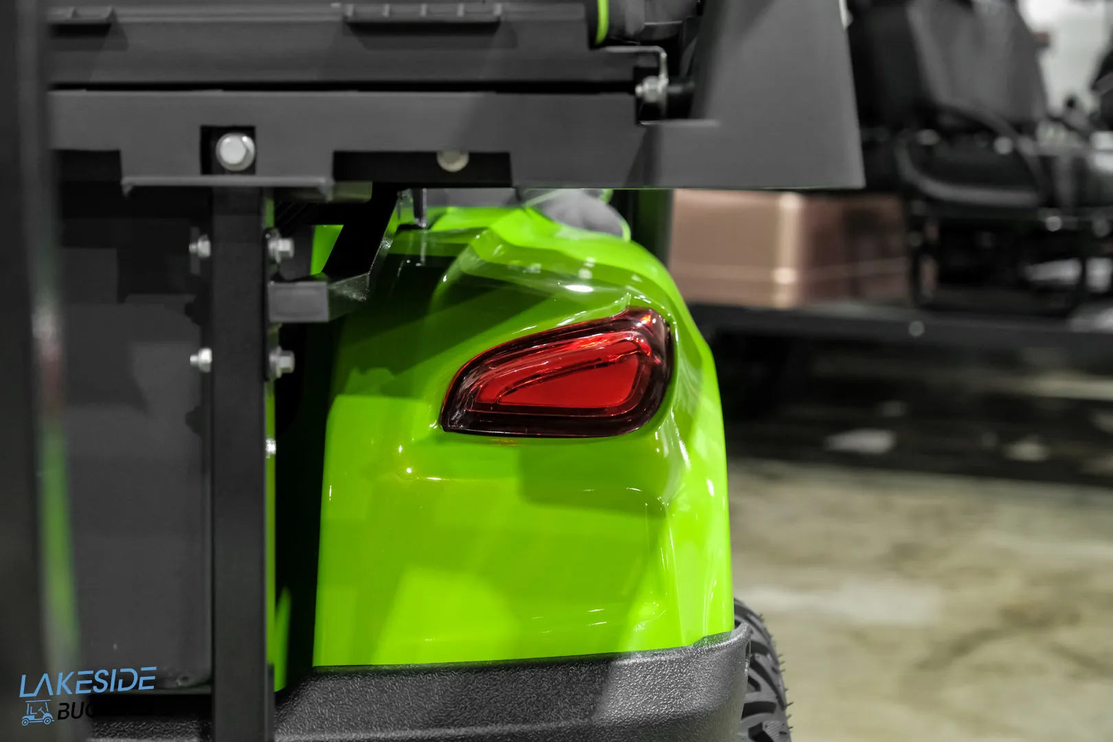 Green golf cart rear.