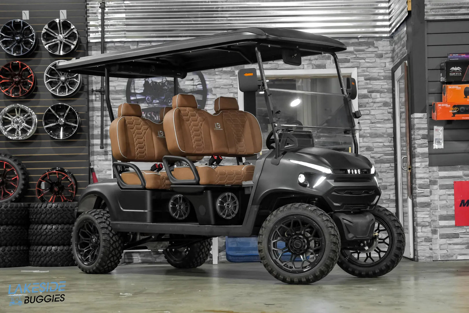 Black six-seater golf cart.