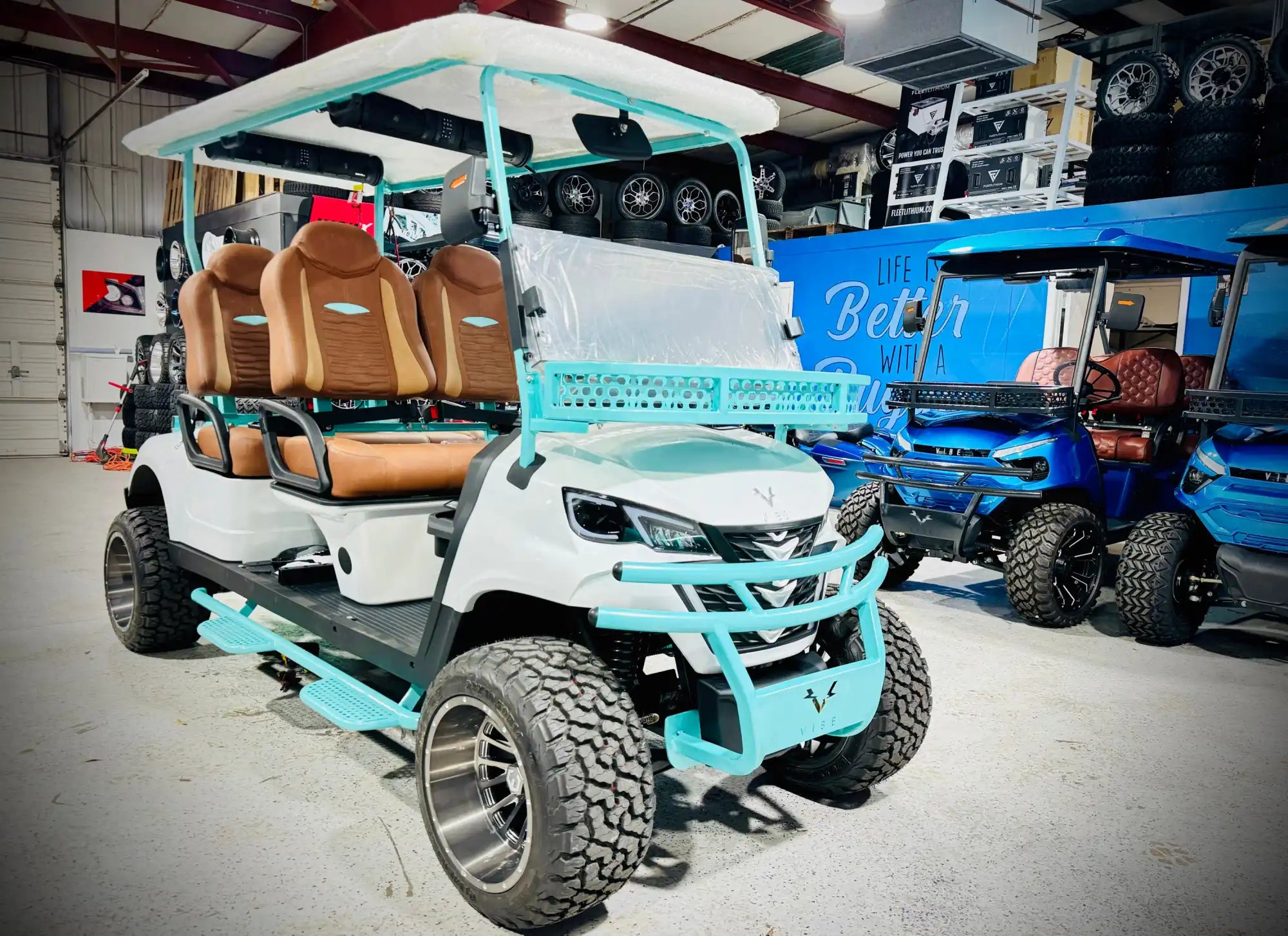 White and turquoise golf cart.